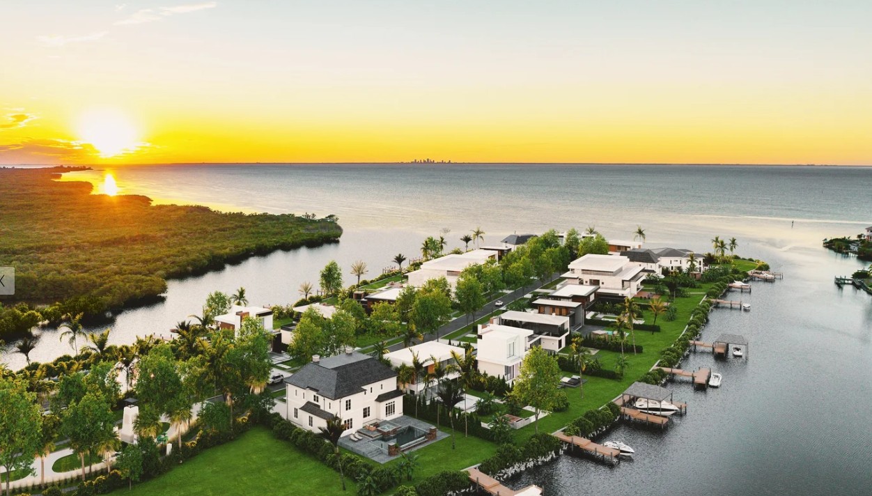 Sunset aerial view over Tampa Bay waterfront estates and private docks