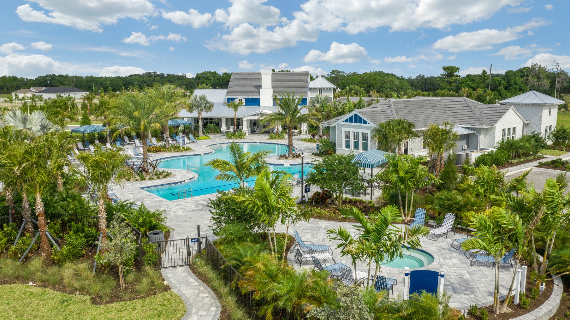 Canoe Creek amenity center aerial with resort-style pool, cabanas, and clubhouse