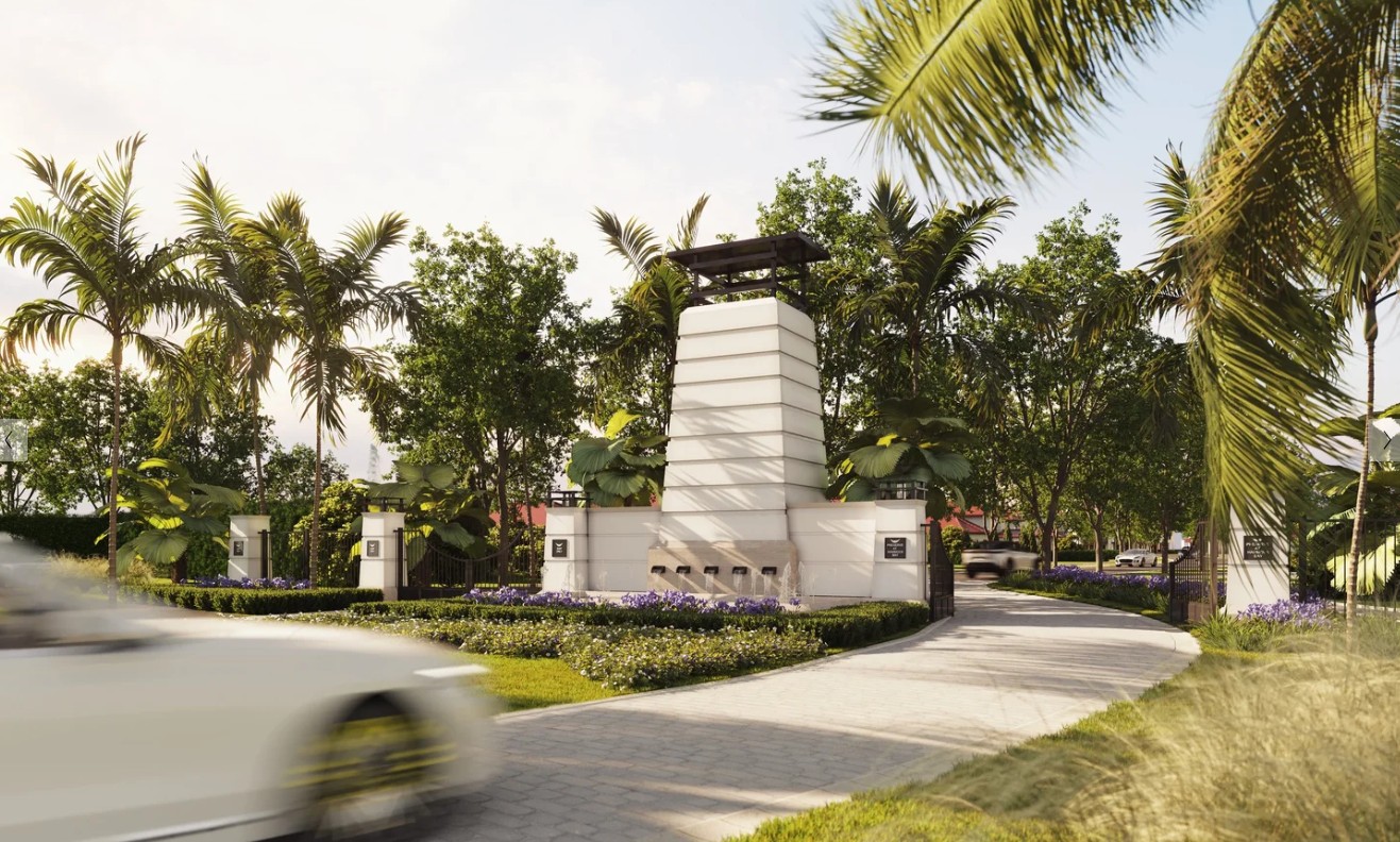 Sculptural white entry tower with fountains and lush palm plantings at Tampa Bay community gateway