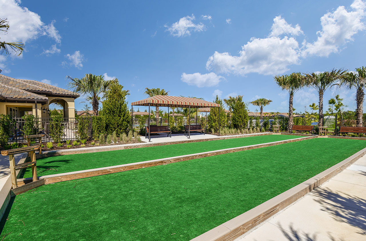 Community amenity bocce courts with shaded pavilion at Milano