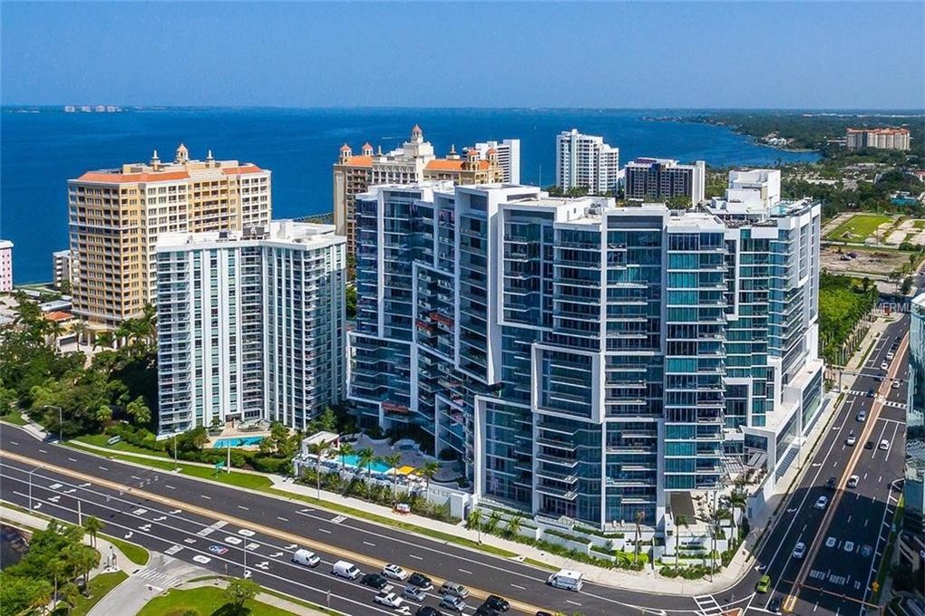 The Westin Sarasota — luxury bayfront tower with curated coastal landscape and palm-lined approach